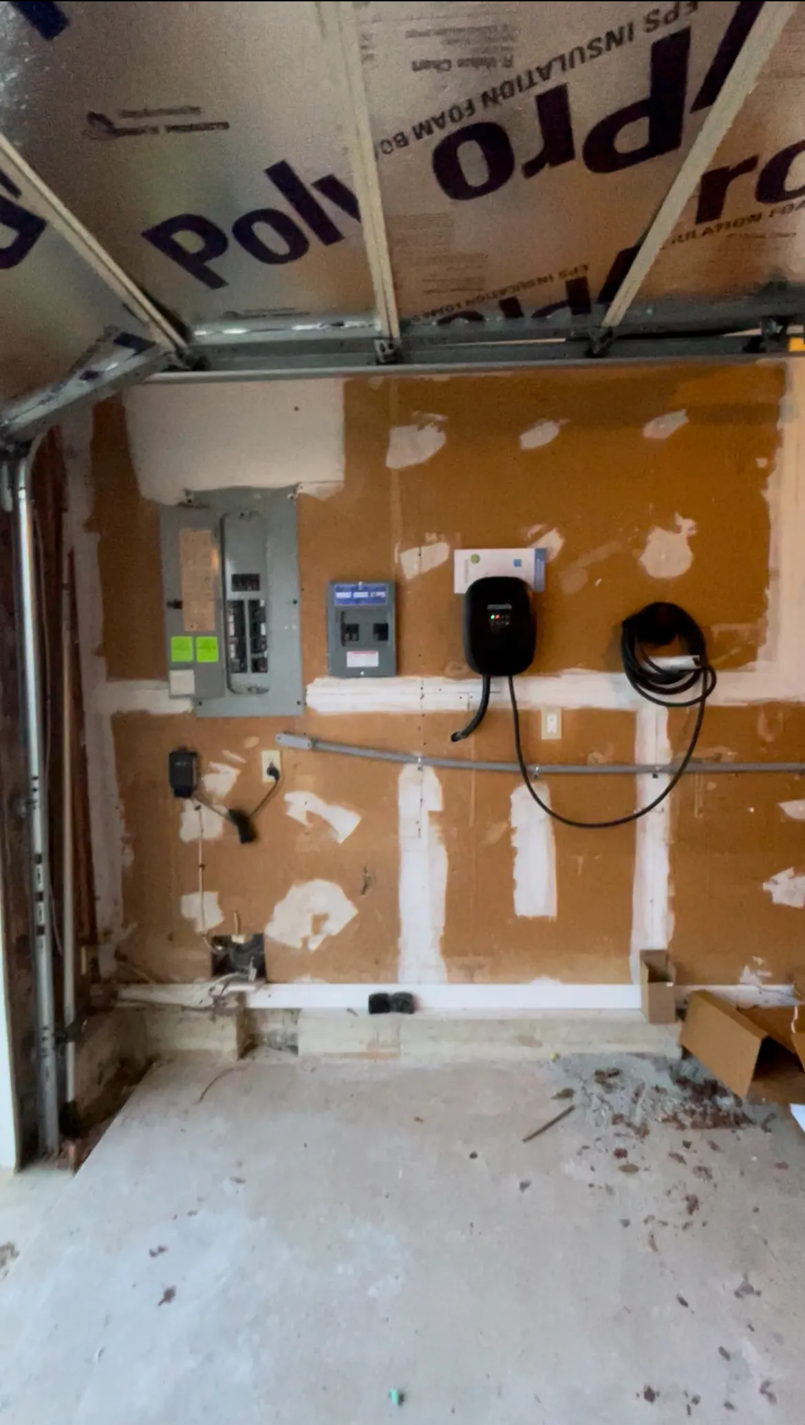 EV charger being installed in a New Castle, DE garage